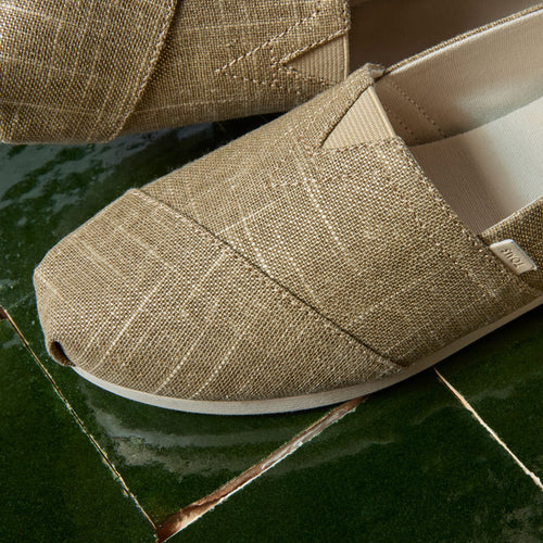 Laydown detail image of the gold shimmer Alpargata