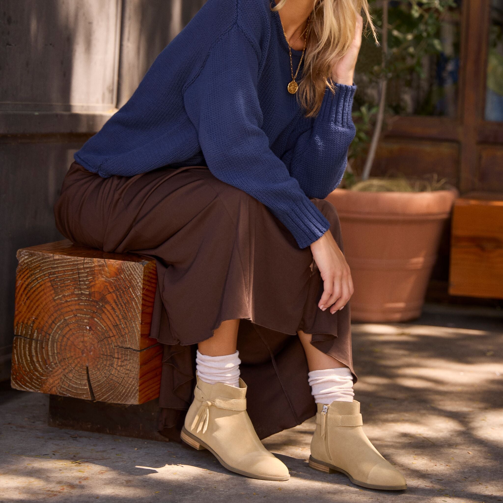On model image of the Womens Stacey Ankle Bootie Taupe Suede